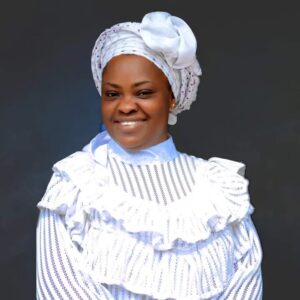 Kemi Rehoboth wearing white gown